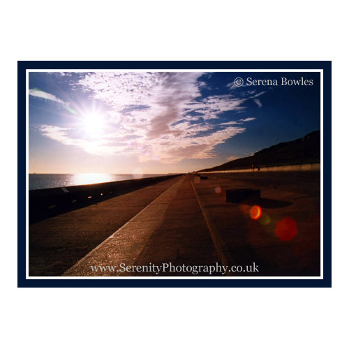 Striking shot along a seawall, which disappears into the distance. Samphire Hoe, England.